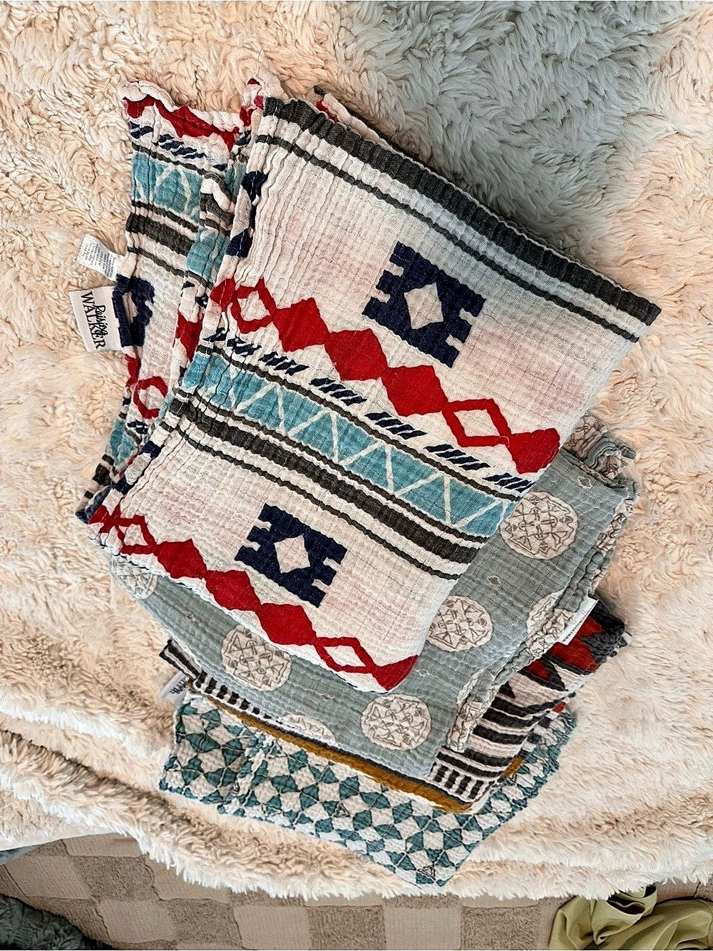 Geometric muslin baby swaddles in Blue & Red